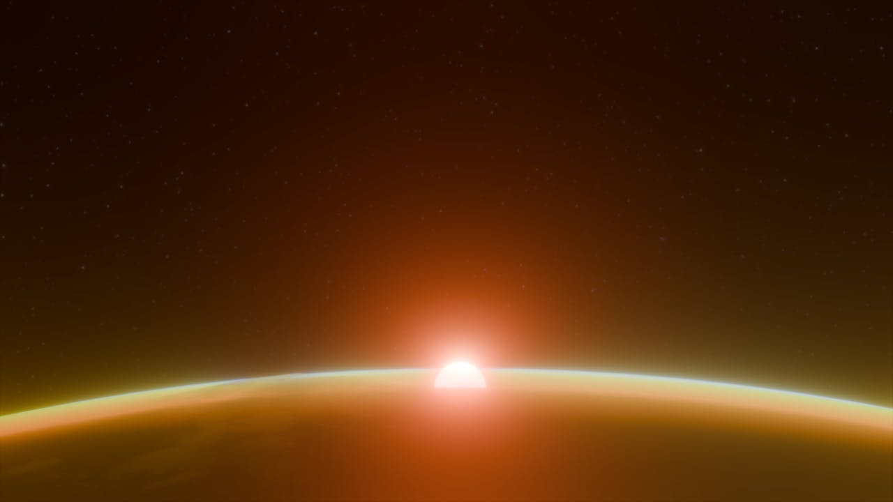 A stunning view of the sunrise over Earth's horizon with a cosmic background.