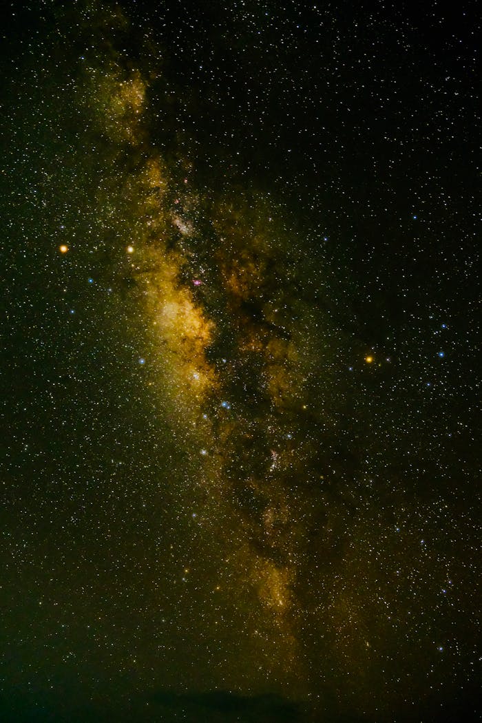 Explore the breathtaking view of the Milky Way galaxy with a vivid starry backdrop captured during a clear night.